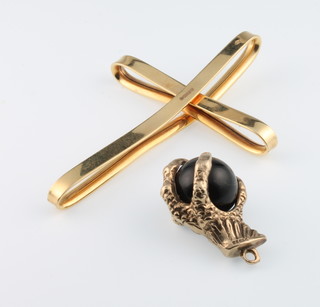 A 9ct yellow gold open cross pendant 3.8g and a 9ct mounted claw and ball charm