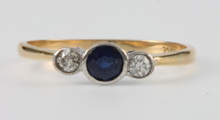 An 18ct yellow gold 3 stone diamond and sapphire ring size R