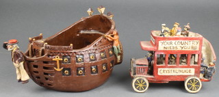 A Bob Fitzgerald glazed bowl in the form of a galleon 9" and a model of an omnibus 8"