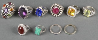 Ten gem set silver rings