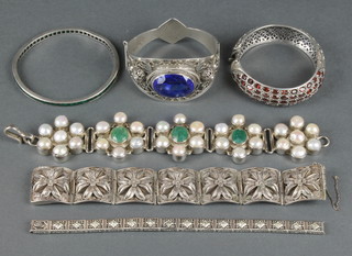 A quantity of gem set silver bracelets