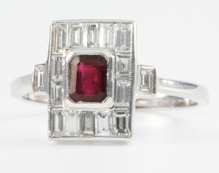 An 18ct white gold ruby and diamond Art Deco style up finger ring Size O