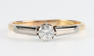 An 18ct yellow gold single stone diamond ring, size P 1/2