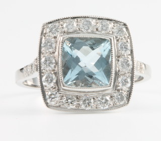 An 18ct white gold aquamarine and diamond  Edwardian style dress ring, Size N