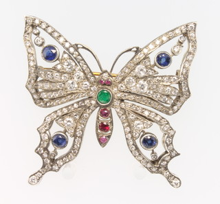  A yellow gold Edwardian style diamond ruby sapphire and emerald butterfly brooch 2" x 1 3/4"