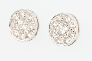 A pair of white gold diamond target ear studs