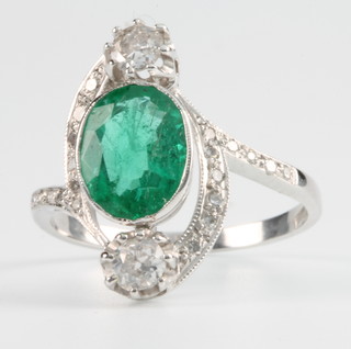 An 18ct white gold emerald and diamond Art Deco style dress ring Size M