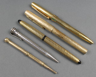 A gilt propelling pencil, a silver Eversharp ditto and 3 fountain pens