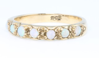 A 9ct yellow gold 7 stone opal ring, size P, boxed with a ring size clip