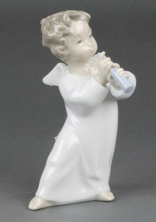 A Lladro young angel playing a flute 4540 6 1/4" Boxed