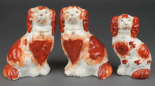 A pair of Victorian Staffordshire ochre spaniels 6" a single ditto 4"