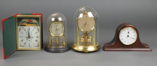 Two 400 day clocks complete with domes, a battery operated mantel clock in an Admirals hat shaped case and a Roger Lascelle timepiece 
 
