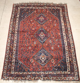 A Persian Qashqai rug 120" x 90", this rug has a small hole 