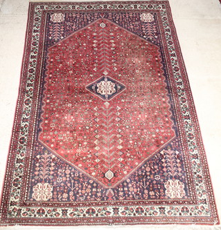 An Adabeh carpet with blue and red ground and lozenge shaped diamond to the centre 111" x 82" 