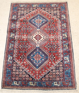 A Persian Yalameh blue and brown ground rug with 3 stylised diamonds to the centre 59" x 42" 