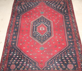 A red and blue ground Persian Afshar carpet with central diamond within multi-row border, some wear to the centre 152" x 120" 