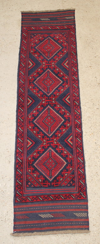 A contemporary red and blue ground Meshwani runner with 4 diamonds to the centre 88" x 22" 