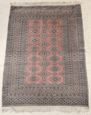 A brown ground Bokhara carpet with 20 stylised octagons to the centre within a multi-row border 68" x 50" 