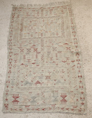A 19th Century white ground rag style rug decorated trees and figures 74" x 45" 