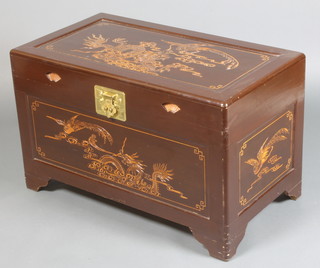 A mid 20th Century carved camphor wood blanket chest decorated with dragons with brass hinge, raised on bracket feet 21"h x 35"w x 19"d 