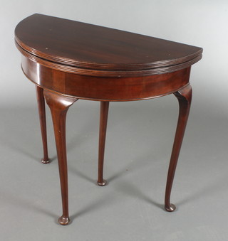 A 1930's Georgian style demi lune card table, raised on club supports 29"h x 30"w x 15" when closed x 30" when open 