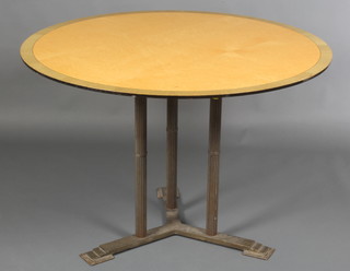 An Art Deco circular birdseye maple and crossbanded breakfast table, raised on 3 turned and reeded metal supports with triform base 29"h x 42" diam. 