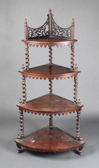 A mid Victorian 4 tier mahogany corner what-not with fret top gallery on barley twist supports, raised on turned feet, 58"h x 21"w x 14"d 