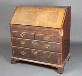 A George III crossbanded and inlaid mahogany bureau, the fall front revealing a well fitted interior with secret drawers and well above 2 short and 2 long drawers, raised on bracket feet 39"h x 36"w x 20"d 