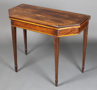 A 19th Century mahogany shaped card table with inlaid and crossbanded top, raised on square tapering supports, spade feet, 28"h x 36"w x 18"d 