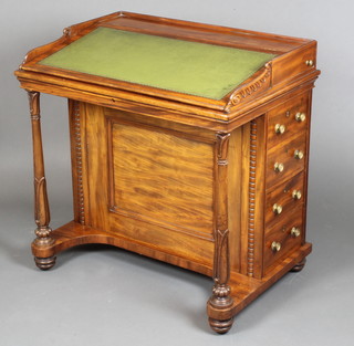 In the manner of Gillows, a  fine Regency mahogany double Davenport with three-quarter gallery, the pedestals fitted 2 inkwell drawers above 8 short drawers with brass handles and escutcheons and turned columns to the sides 32"h x 31"w x 22"d 