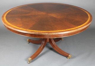 A Victorian style circular mahogany breakfast table with quarter veneered and crossbanded top, raised on a turned column and platform base 28"h x 60" diam. 