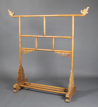 A Chinese carved and pierced hardwood stand 56"h x 55"w x 18"d 
