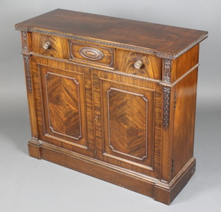 An Edwardian Chippendale style carved mahogany side cabinet with crossbanded top fitted 1 long drawer above double cupboard enclosed by carved panelled doors 31"h x 36"w x 14"d 