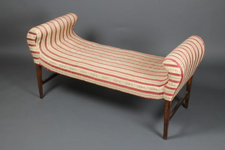 A Regency mahogany window seat upholstered in red striped material, raised on square tapered supports 25"h x 52"w x 20"d 