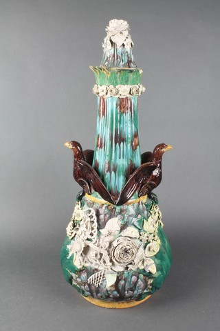 A 19th Century Continental Majolica baluster vase with elongated neck and lid applied with eagles and flowers 26" 