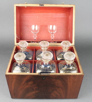 A 19th Century mahogany dome topped liqueur box containing 6 square gilt decorated decanters with mushroom stoppers and 2 spirit glasses 