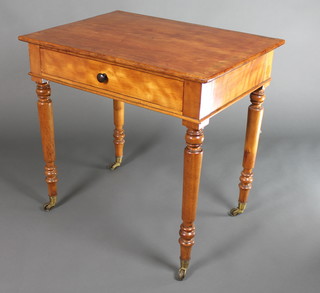 A Victorian 19th Century rectangular mahogany side table fitted a frieze drawer and raised on turned supports, brass caps and castors 28 1/2"h x 30"w x 21 1/2"d 