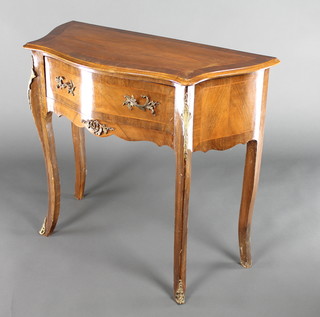 A French style shaped mahogany and crossbanded side table fitted a drawer and raised on cabriole supports with gilt metal mounts 29"h x 33"w x 13"d 