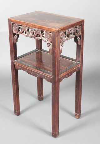 A Chinese rectangular carved Padouk wood 2 tier occasional table on square supports with pierced apron and undertier 32"h x 17"w x 12"d 