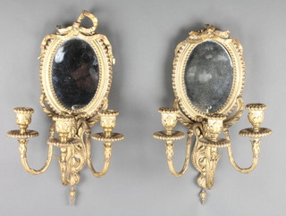 A pair of 19th/20th Century oval mirrored 3 light candle sconces with gilt plaster and wood frames 19" x 7" 