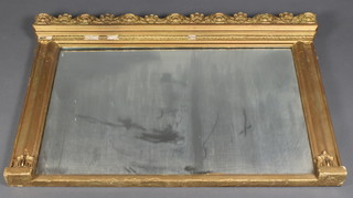 A 19th Century rectangular plate over mantel mirror contained in a gilt plaster frame with scroll decoration the sides 31" x 44"w 
 