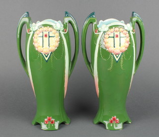 A pair of Art Nouveau  Austrian green pottery twin handled vases 11" 