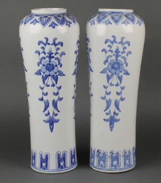 A pair of 20th Century Chinese blue and white extended cylindrical tapering vases decorated with geometric bands of flowers and leaves, bearing a character mark to base 17" 