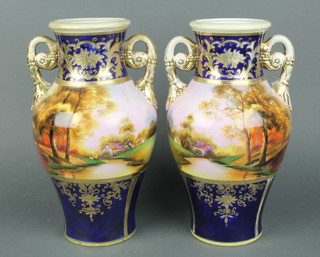 A pair of mid 20th Century Noritake baluster vases with Autumnal panels on a blue and gilt ground 11" 