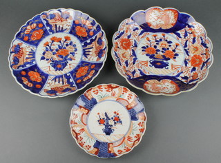 An early 20th Century Imari scalloped dish decorated panels of flowers 12", a ditto 12" and a side plate 8 1/2" 
