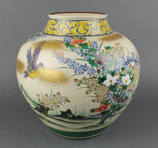 An early 20th Century Japanese bulbous vase, the tan ground decorated with birds amongst flowers 12" 