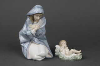 A Lladro figure of Mary kneeling  5477  7" boxed and a ditto of Jesus 5478 3 3/4"