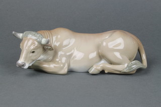 A Lladro figure of a reclining bull 5482 8 1/2" boxed