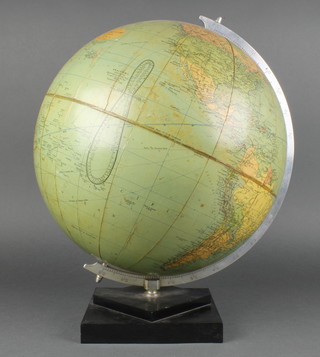 A 1960's Philips Challenge  terrestrial globe 13 1/2", raised on a black Bakelite base 