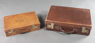 A brown leather attache case with metal locks 4"h x 16"w x 11"d together with a brown suitcase with brass locks 6"h x 20"w x 13"d 